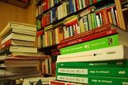 books in shelf and on table